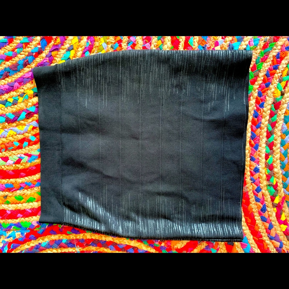 Black textured mini skirt.